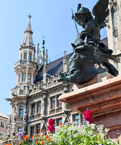 statue and buildings in the marienplatz of munich germany