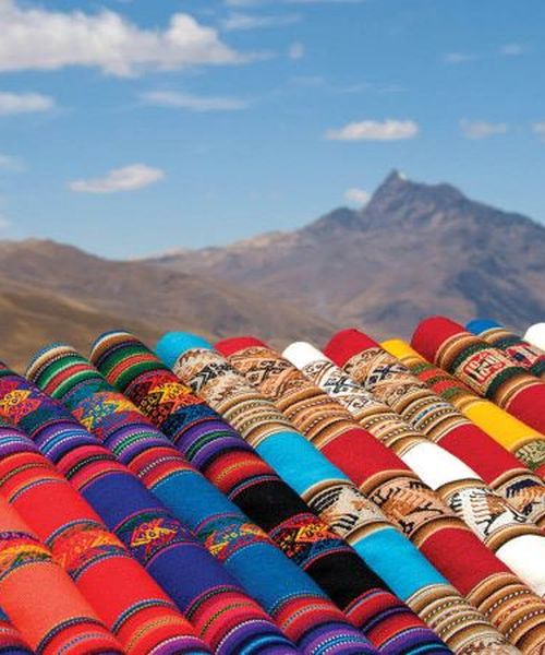 traditional textiles overlooking mountains in peru