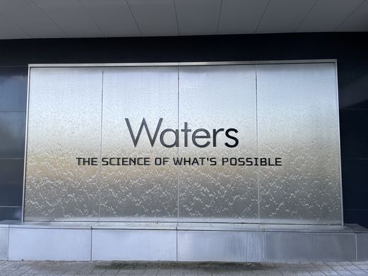 The Waters logo is seen at the front of their Wimslow offices. It is accompanied by the phrase "The science of what's possible".