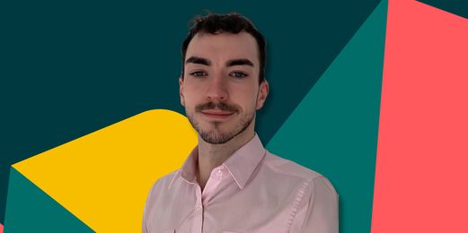 Portrait of a person in a pink shirt with a colourful geometric abstract background.