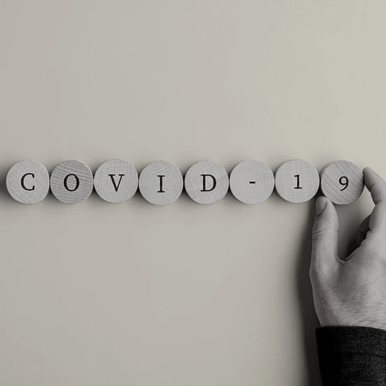 covid letters in round wooden circle blocks