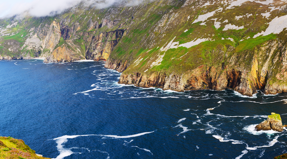 rugged cliffs along the atlantic ocean on the wild atlantic way in ireland