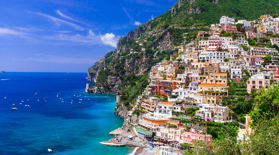 colorful buildings in positano along the blue waters of the amalfi coast
