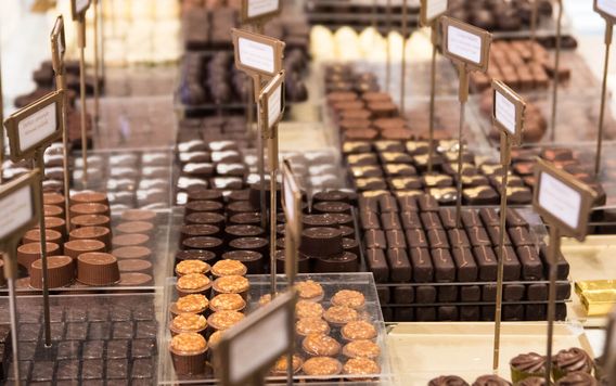 close up of chocolates being displayed at a shop