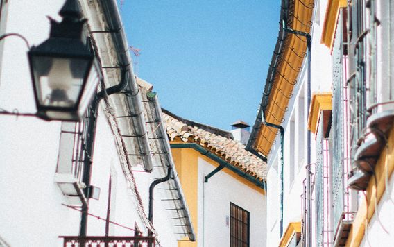 white building with bright yellow trim in spain