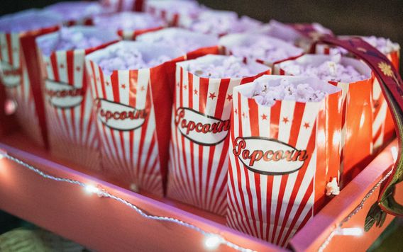 red and white stripped bags filled with popcorn