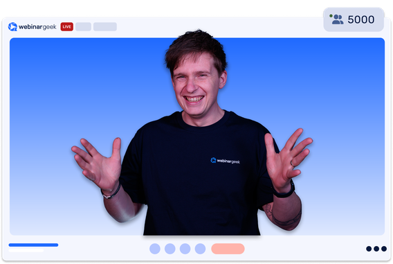 Man smiling during a live webinar, wearing a black "webinargeek" T-shirt. Viewer count is at 5000, with a blue gradient background.