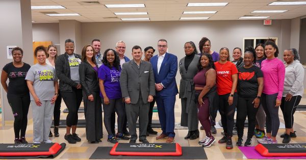Capital Blue Cross President and CEO Todd Shamash, center left, and UPMC in PA President and CEO Lou Baverso are flanked by colleagues and program participants during a recent Xtreme Hip Hop class in Harrisburg. The class is one regular - and popular - part of the Healthy Harrisburg initiative.