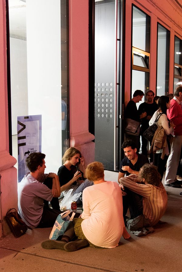 People sitting outside and discussing | Image by ©