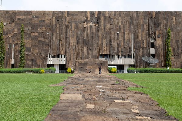 Ibrahim Mahama wraps the K.N.U.S.T Library with coal jute sacks. Kumasi, Ghana, 2014  | Image by ©© Ibrahim Mahama