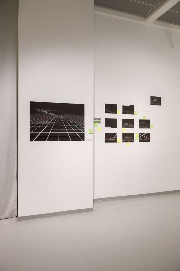 Graphic images on black paper hanging on a wall, graphs and handwritten notes around them | Image by ©