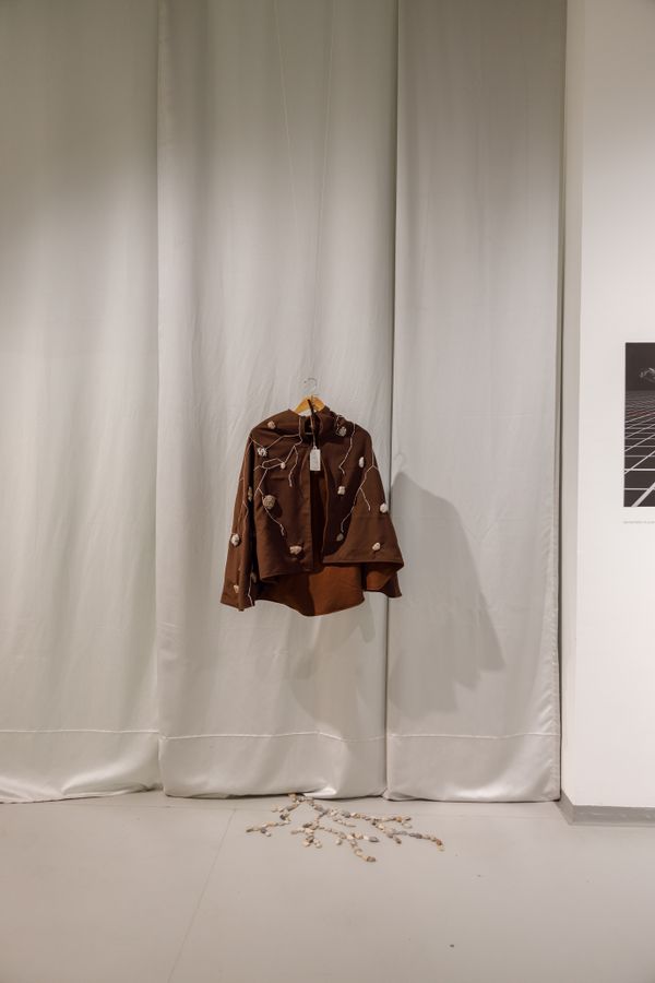 Jacket to wear at the exhibition, with embroidered pebbles on top | Image by ©
