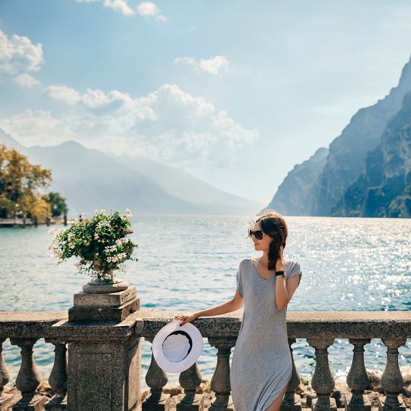woman standing in front of lake como 