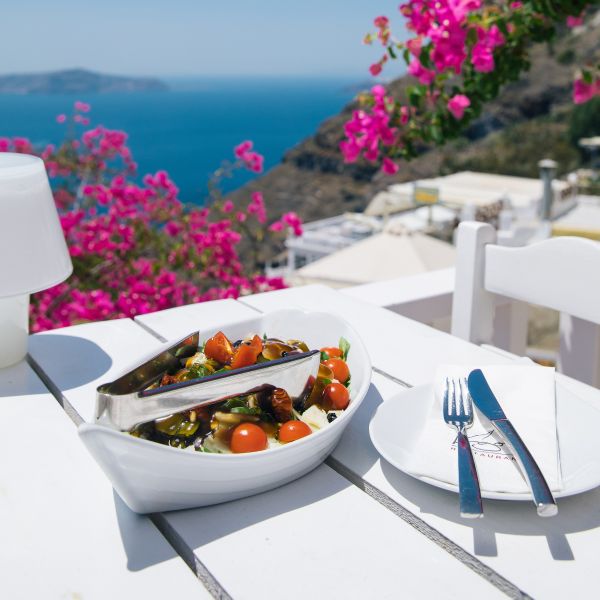 close up of grecian food overlooking the mediterranean sea