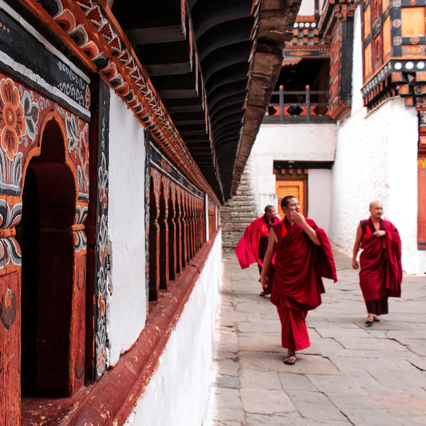 Monks walking in monastery in Paro Bhutan