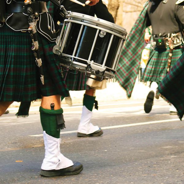 irish musicians walking on road during st patricks day parade in dublin