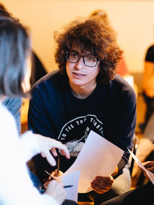 A man engaged in conversation during a workshop