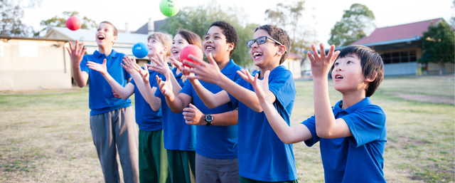Kids juggling outdoors