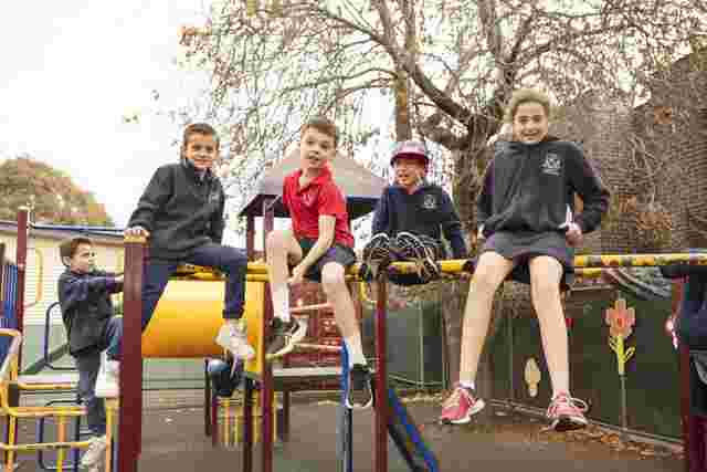 kids smiling at a playground