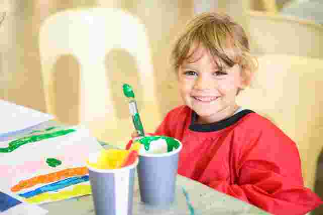 girl painting at an OSHC service