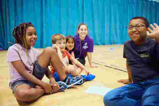 JAG staff and Children in a sports hall