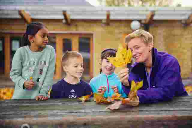 Staff member and children outdoor discovery session