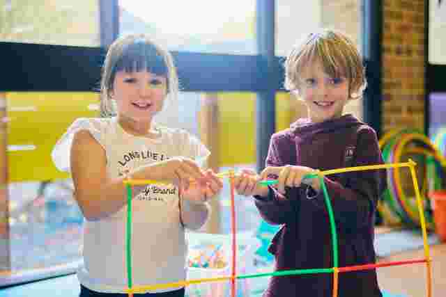 Children building with straws