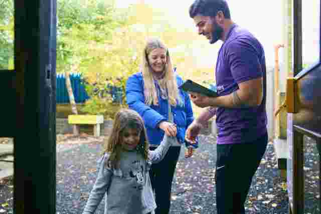 Parent and child drop off to JAG club with staff member welcome