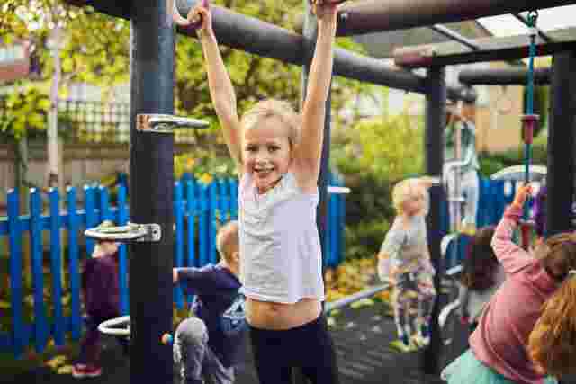 Child having fun on climbing frame
