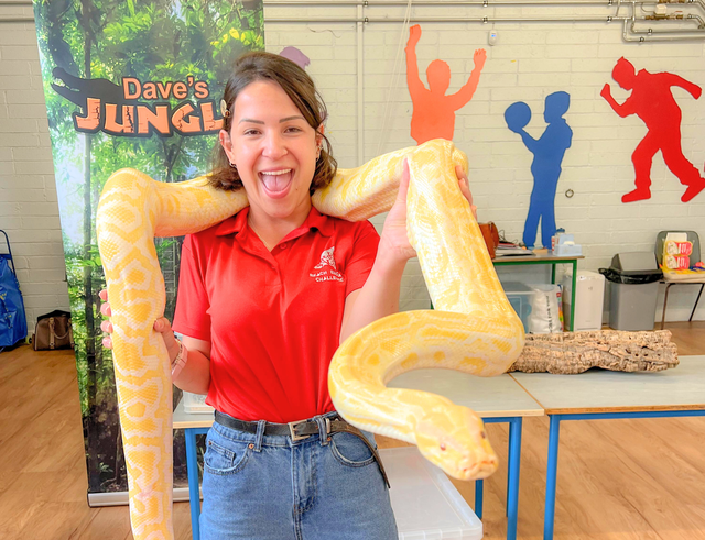 staff posing with a snake