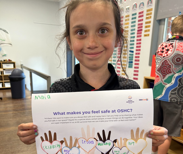 child holding poster