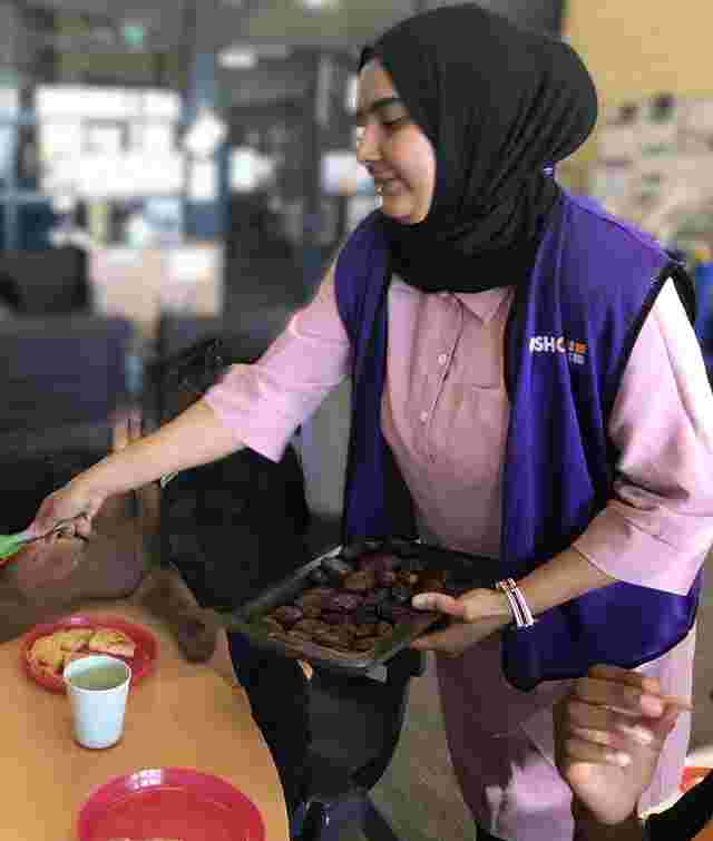 Educator serving dates to children