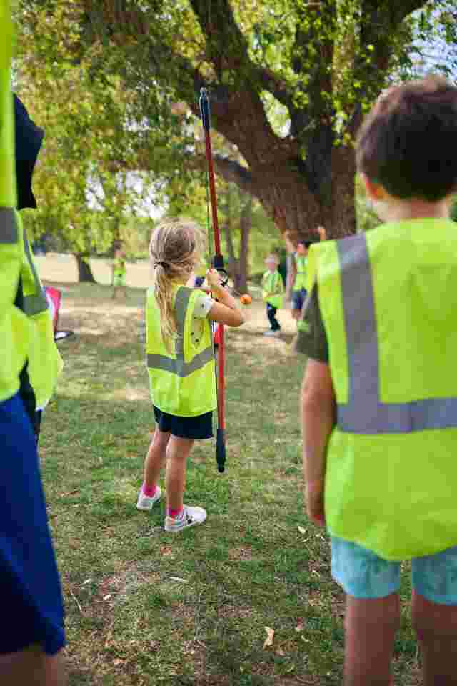 Children playing archery outside