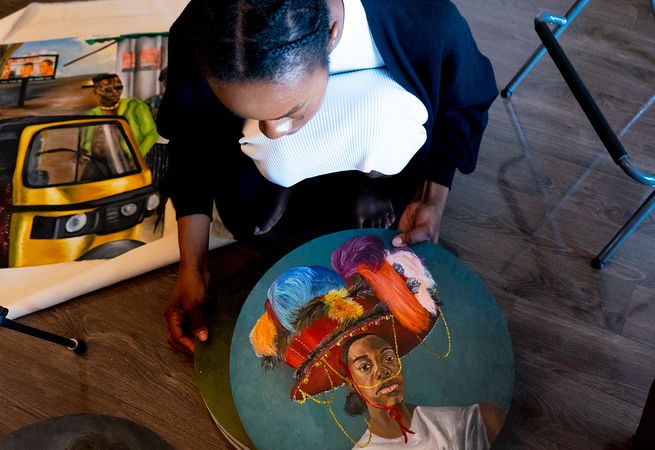 artist Ekene Maduka showing her oval paintings at her studio