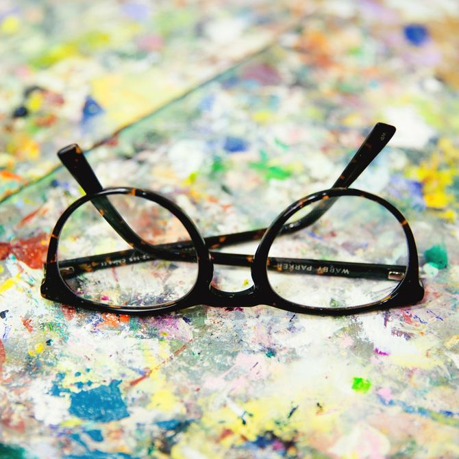 Glasses lying on a paint covered surface