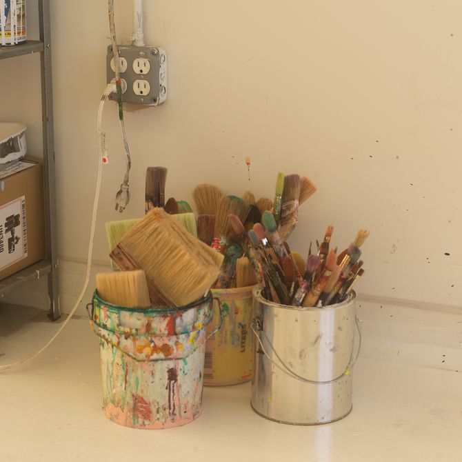Paintbrushes in corner of studio 