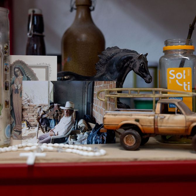 objects on a table of the artist's studio including a toy car