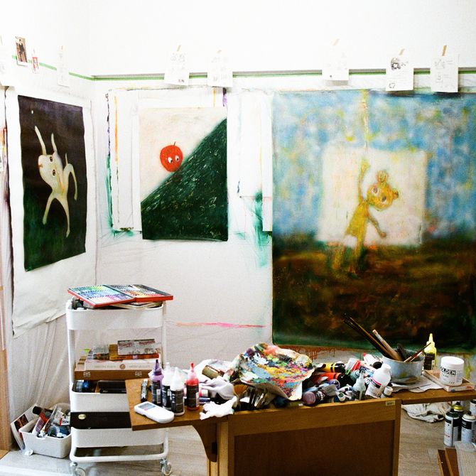 Chen Wei Ting's studio with collections of paint tubes, toys and recent paintings hung