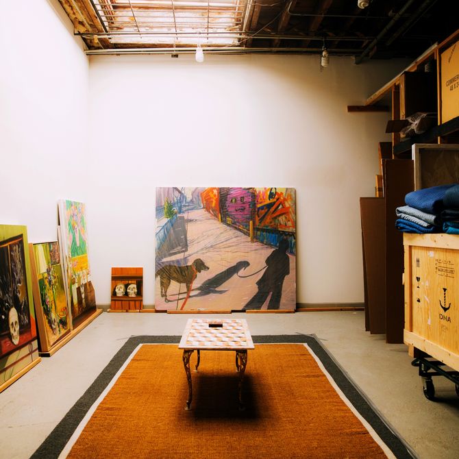 paintings lined up against the walls of Deborah Brown's studio