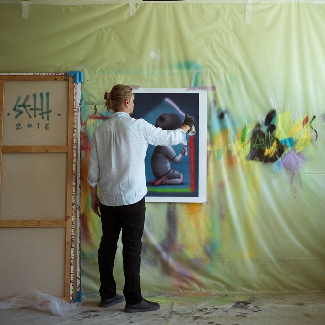 Seth Globepainter painting in his studio