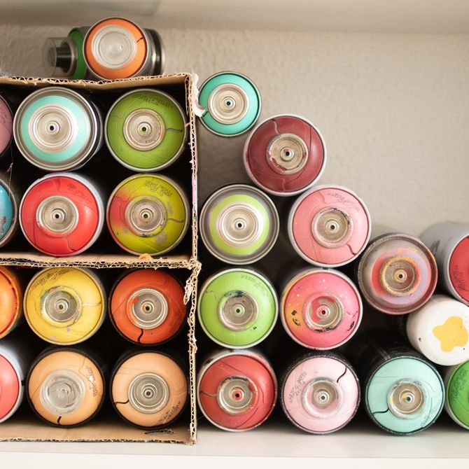 stacks of coloured spray cans