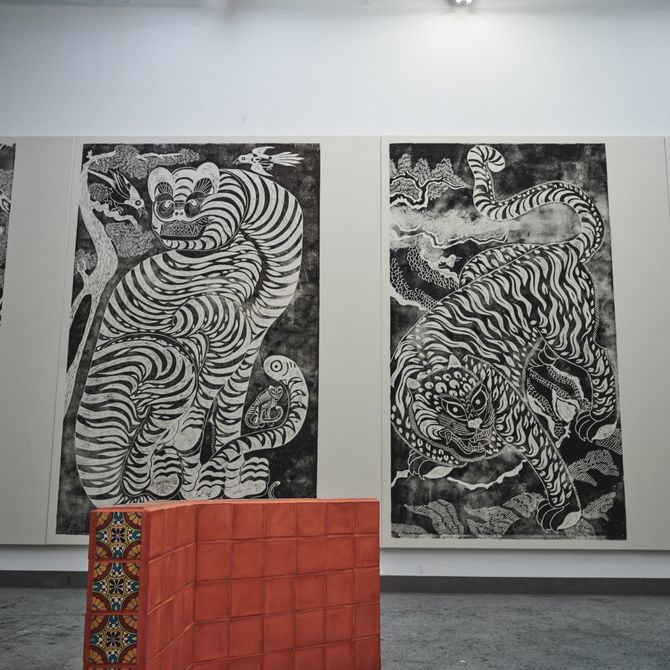 four monochrome, large-scale drawings on a white wall in Kour Pour's studio