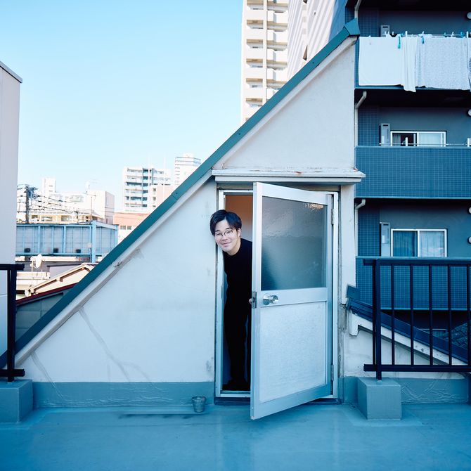 Keita Morimoto coming out of door on roof, smiling