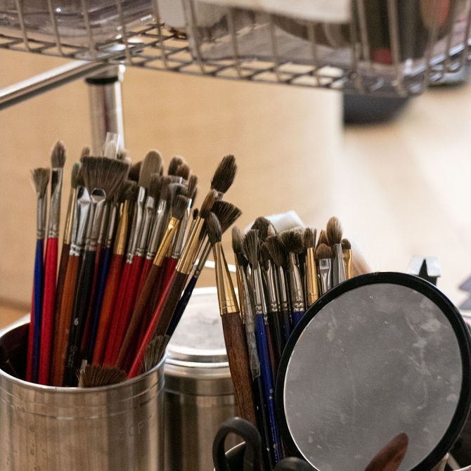 paint brushes in tins 