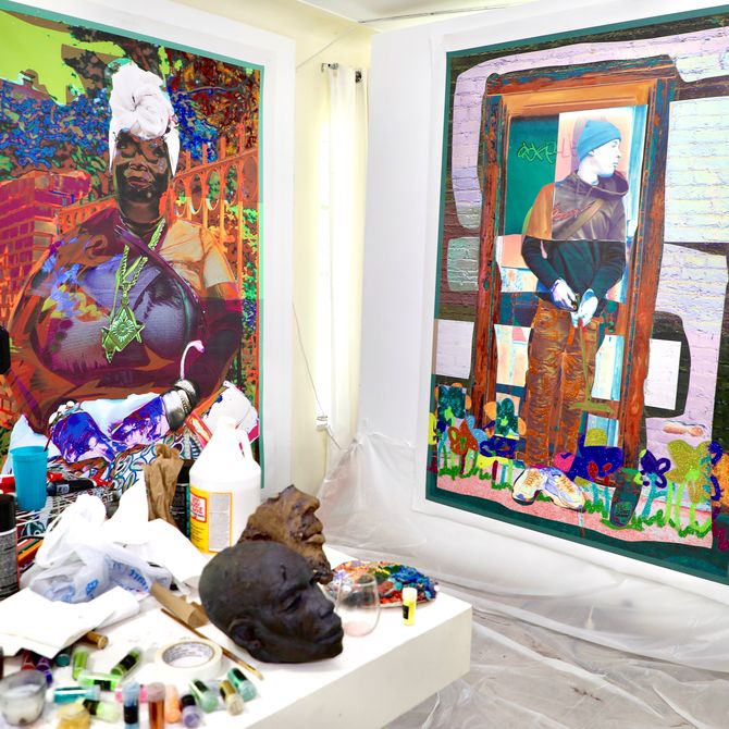 shot of artist's studio with two large paintings on paper taped to the walls