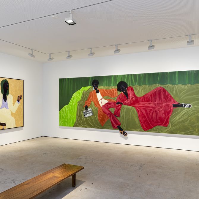 installation view of two figurative paintings by Kwesi Botchway hung in a gallery space