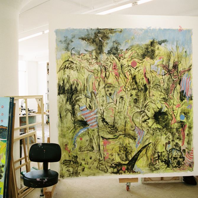 artist's studio with a black office chair placed in front of a large square surrealist painting in mostly yellow paint with black details and lines
