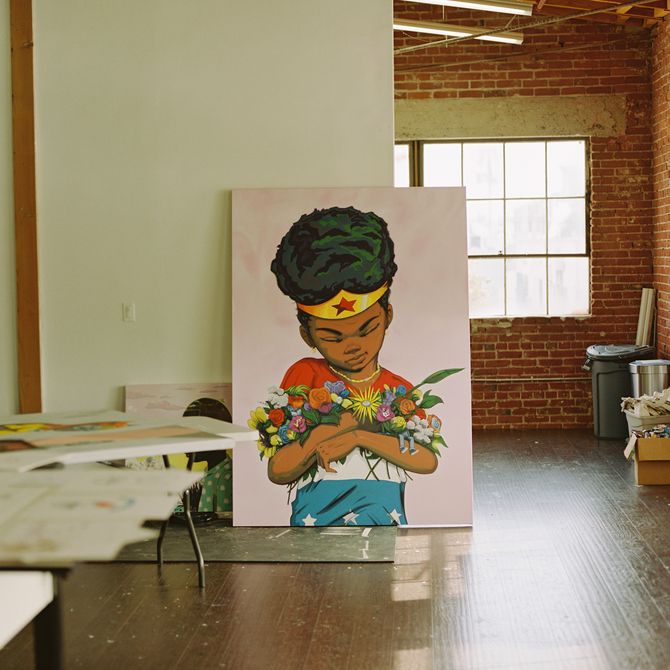 Painting propped up against the wall of Hebru Brantley's studio