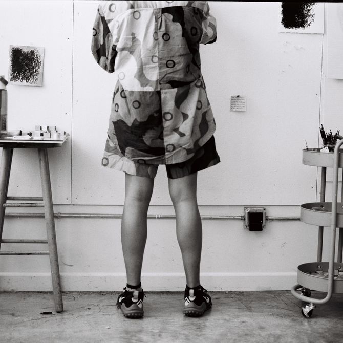 Black and white image of Kenturah working in her studio