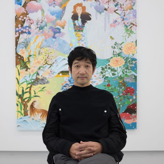 artist Tomokazu Matsuyama sitting in his studio and looking to the camera